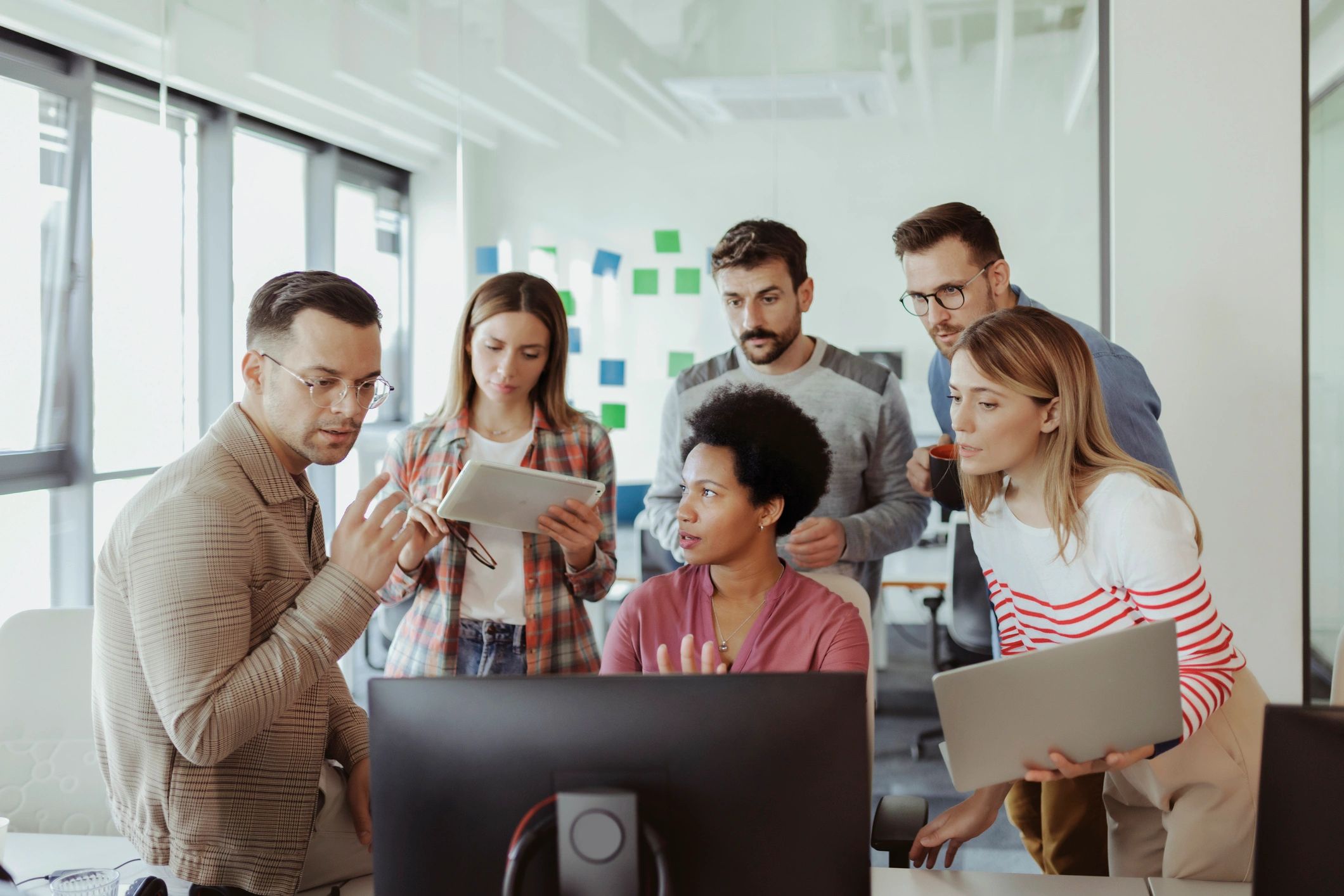 Software development team collaborating in an office