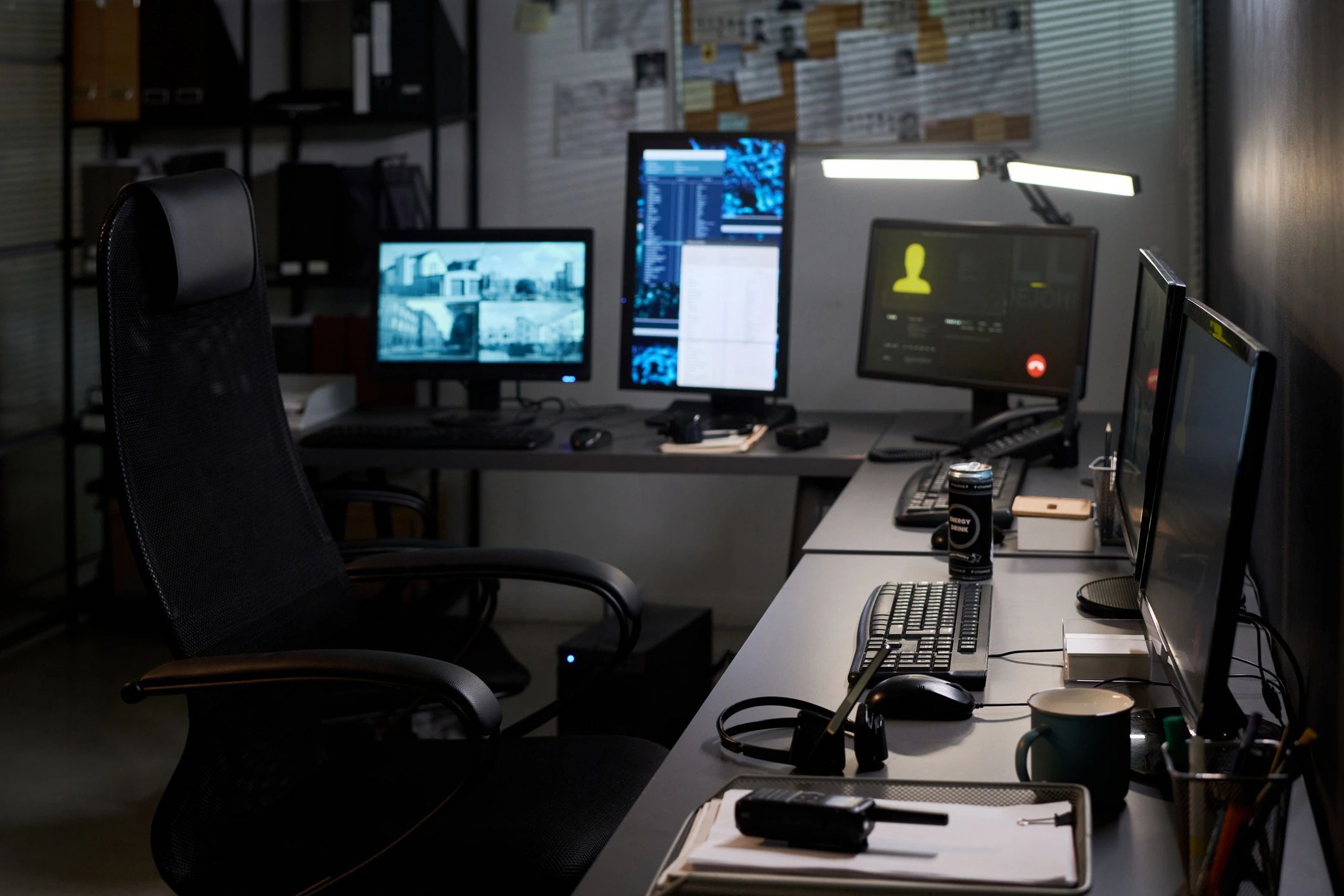 Security operations desk monitoring technology screens